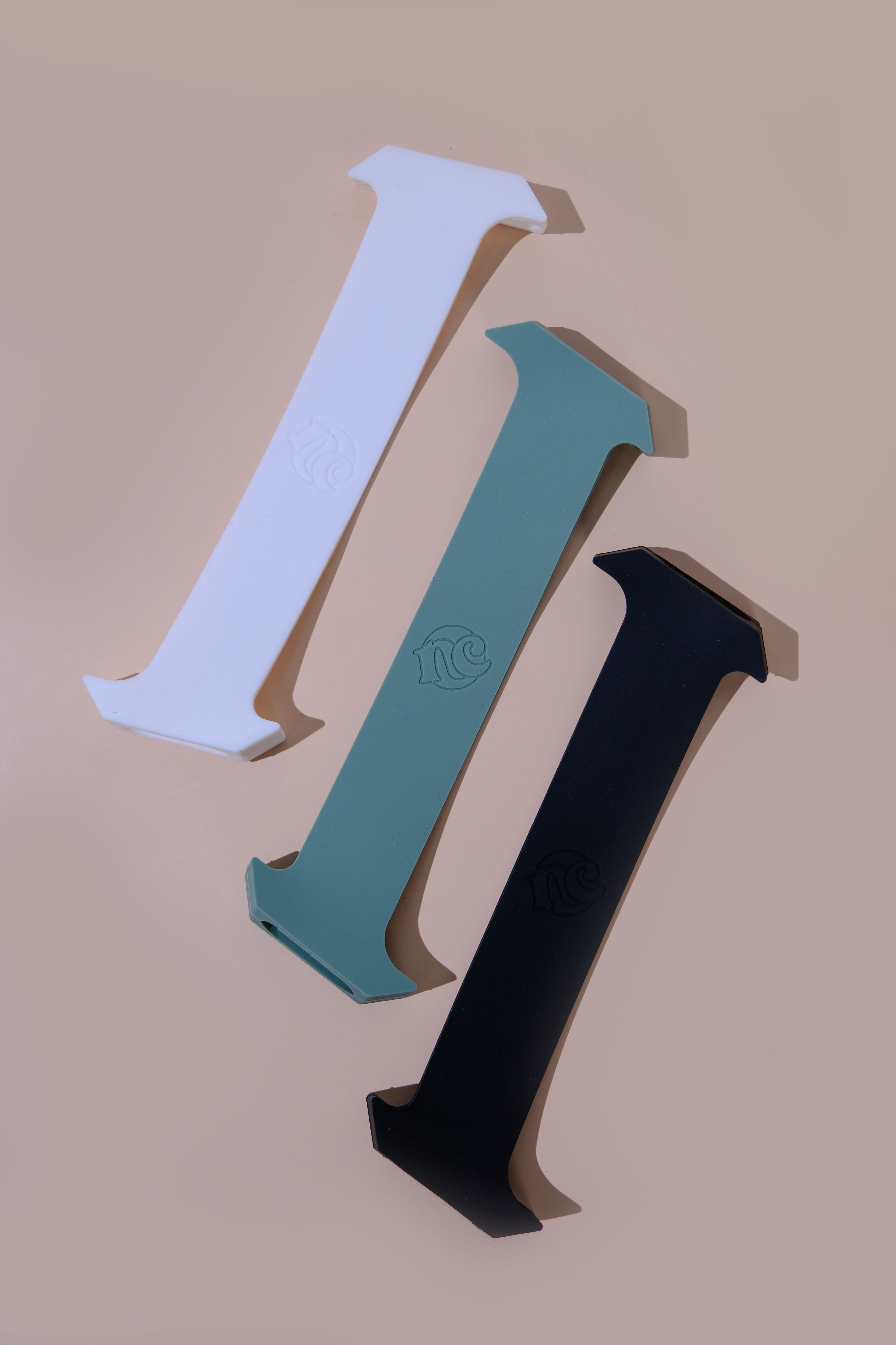 White, sage, and midnight Everstraps laid flat